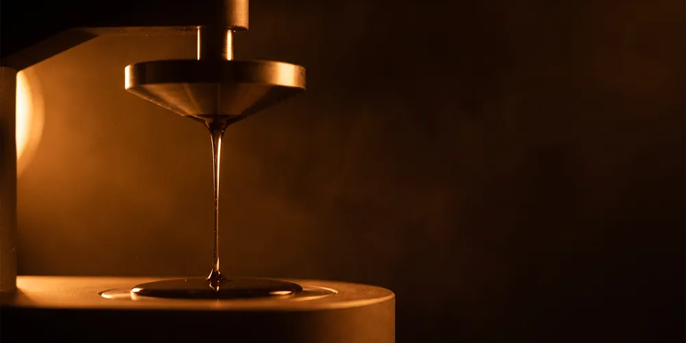 Paint drawing out in a thread from a lifted rheometer cone plate