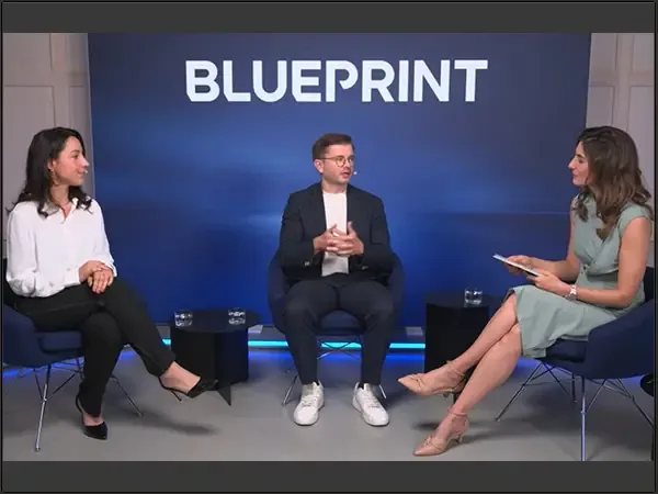 Studio set of the CADFEM Blueprint interview with three people seated in front of a large Blueprint backdrop