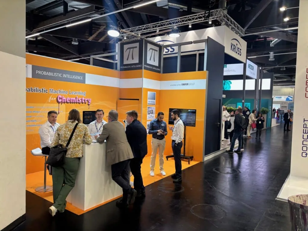 The PI Probaligence booth in the ECS 2025 exhibition hall, marked a member of the CADFEM Group, with visitors in conversation