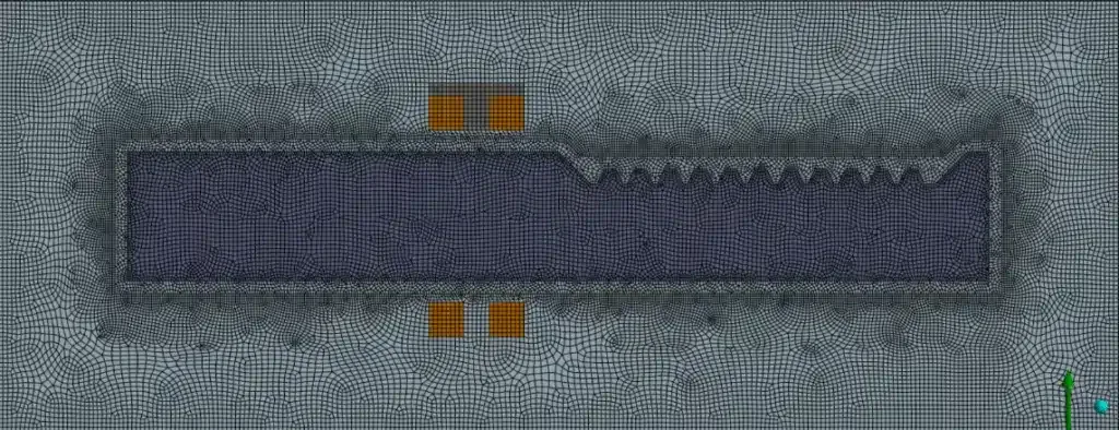 Fine finite element grid of the induction hardening model, with a densely meshed workpiece and surrounding domain